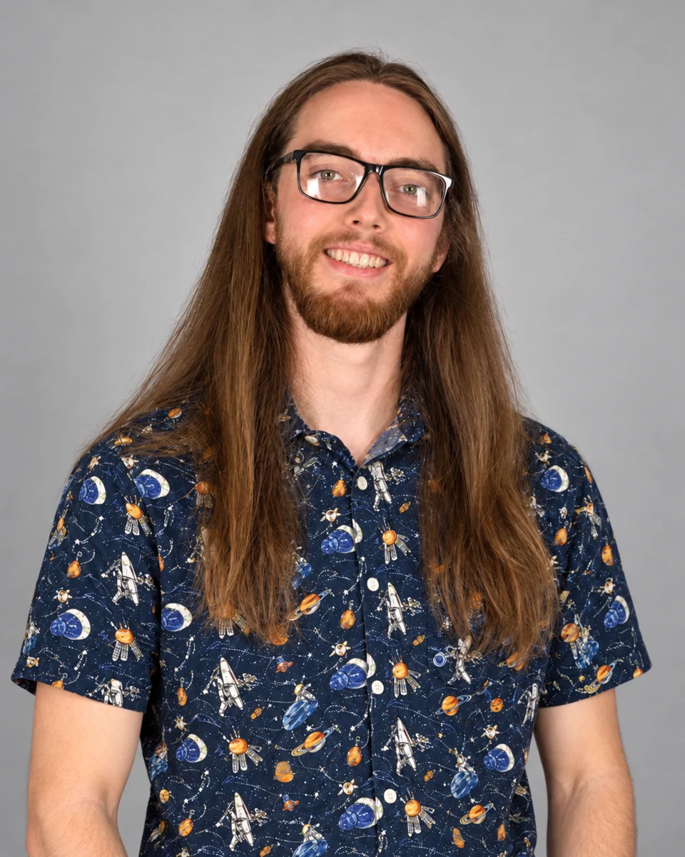 Brady Mayo smiling in a space-print shirt